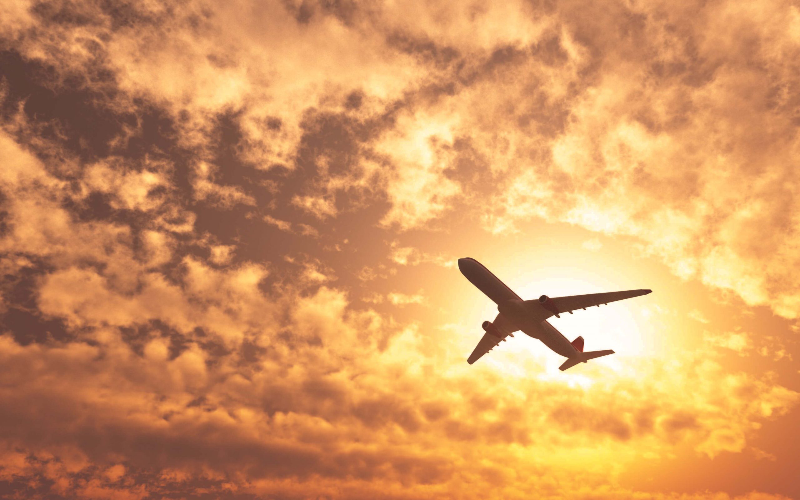plane-passing-by-sun-cloudy-day-1